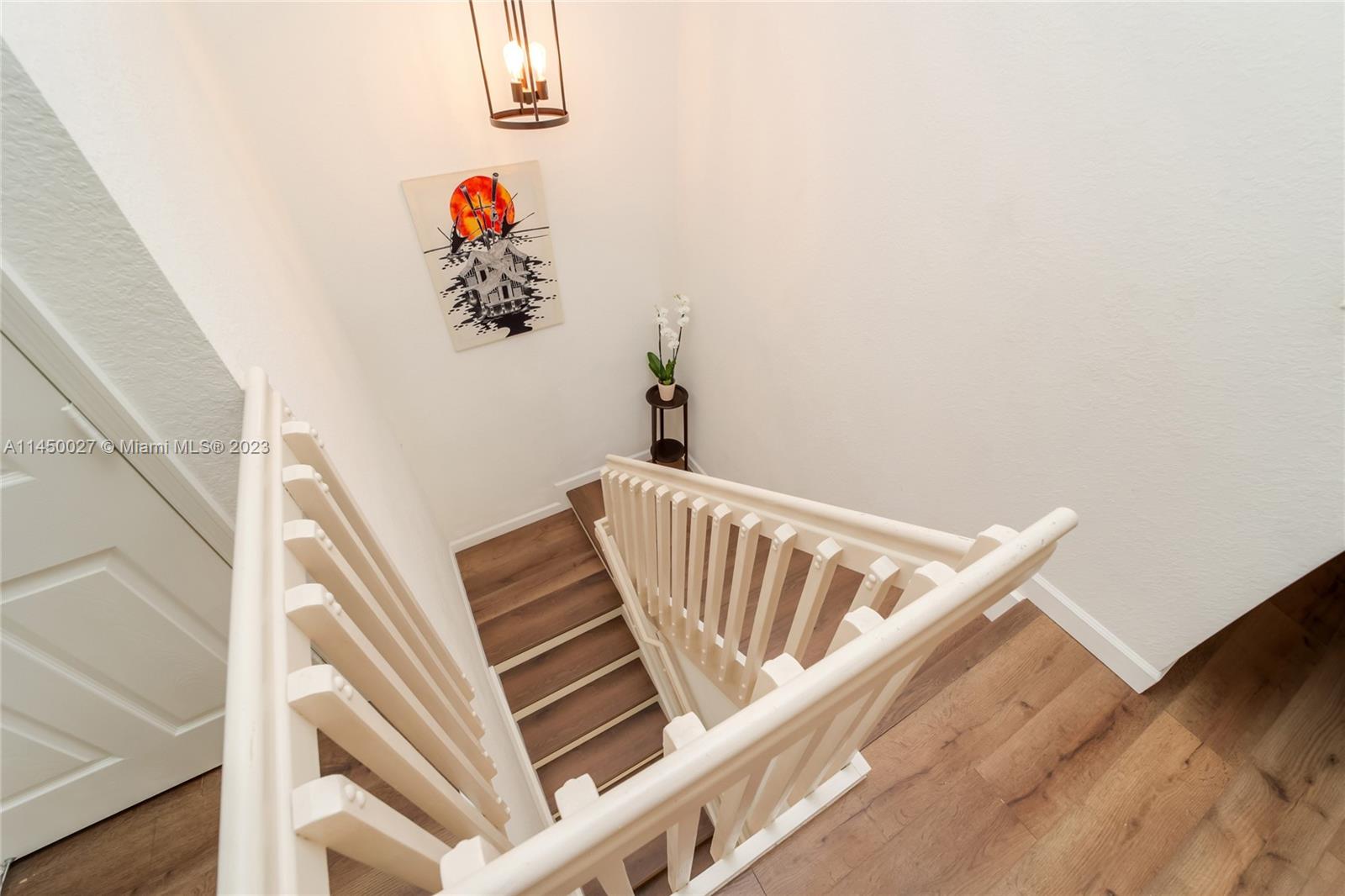 12953 Southwest 132nd Terrace Miami, FL 33186 - Photo 18 of 36 a view of staircase with white walls and a window