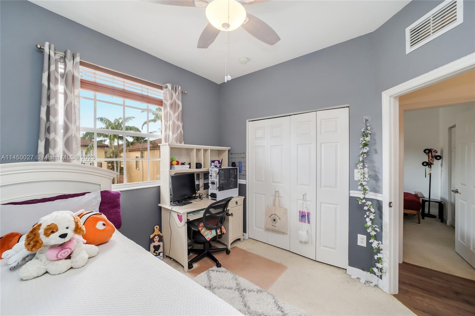 12953 Southwest 132nd Terrace Miami, FL 33186 - Photo 27 of 36 a bedroom with a workspace
