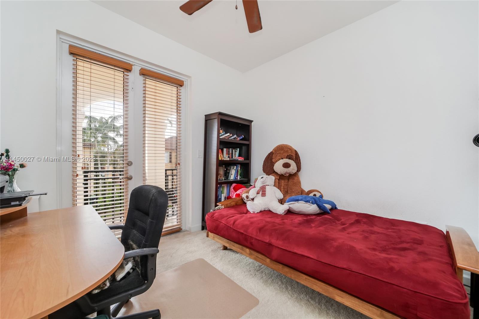 12953 Southwest 132nd Terrace Miami, FL 33186 - Photo 29 of 36 a bedroom with a bed and a window