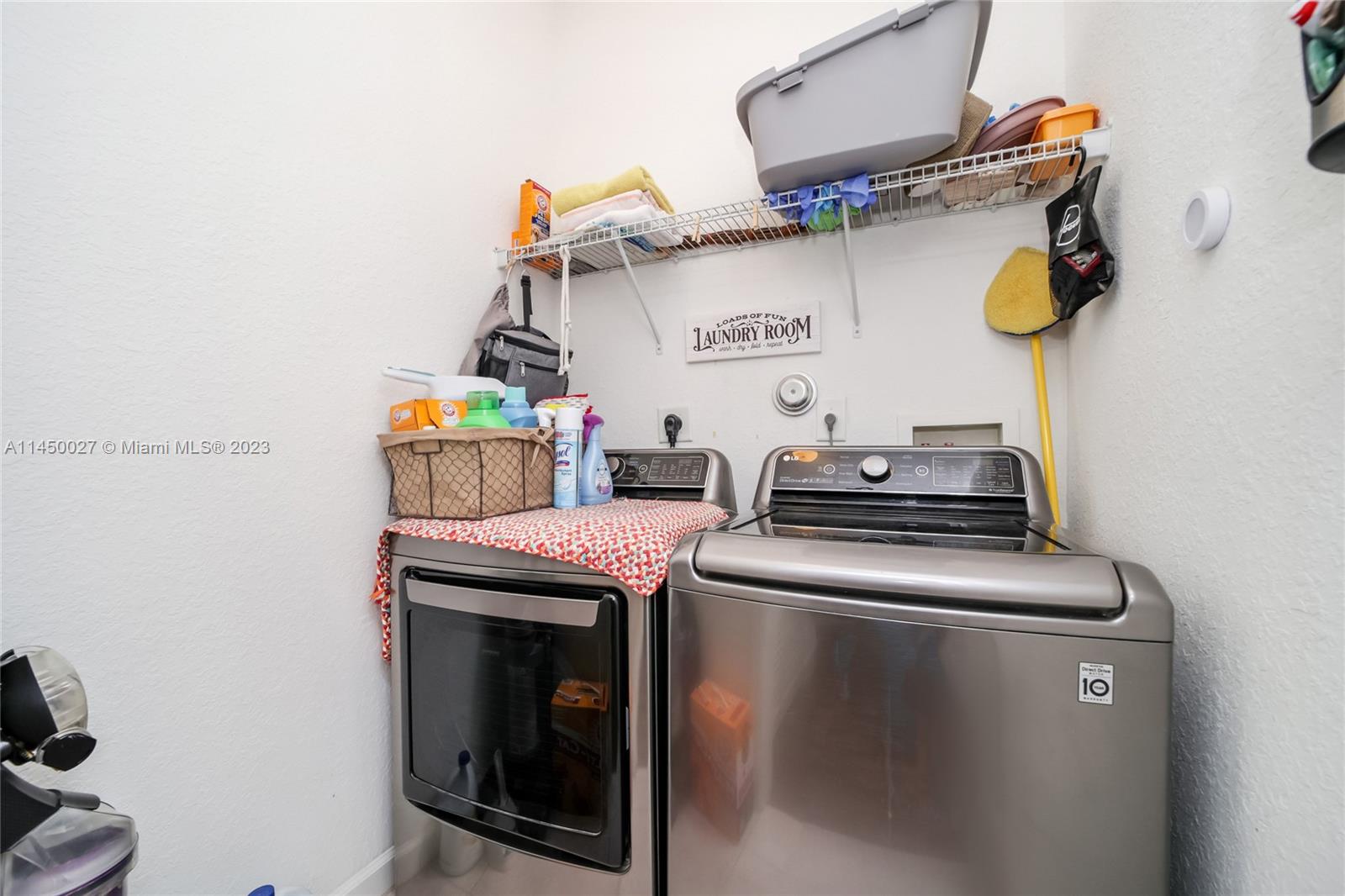12953 Southwest 132nd Terrace Miami, FL 33186 - Photo 30 of 36 a room with storage and utility