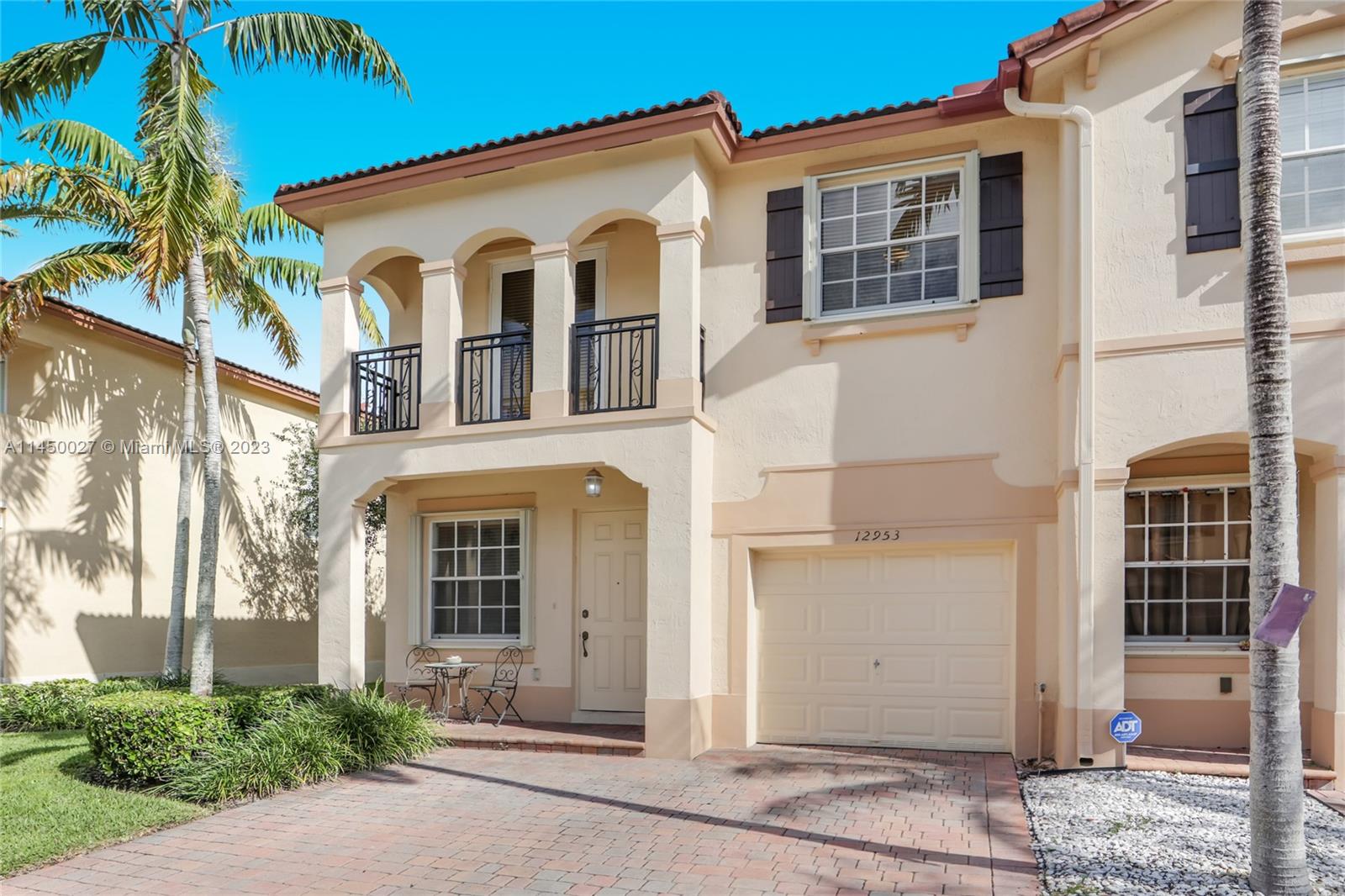 12953 Southwest 132nd Terrace Miami, FL 33186 - Photo 3 of 36 a front view of a house with a yard