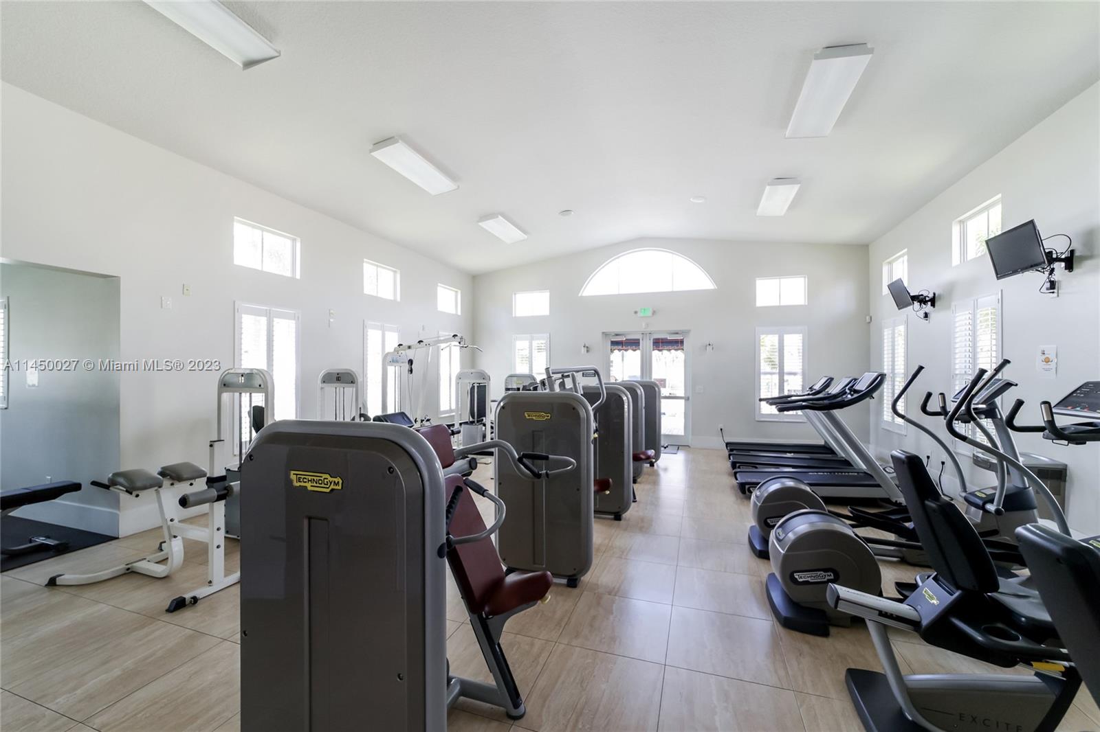 12953 Southwest 132nd Terrace Miami, FL 33186 - Photo 32 of 36 a view of a room with gym equipment