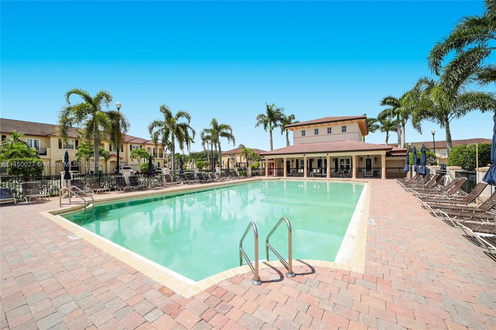 12953 Southwest 132nd Terrace Miami, FL 33186 - Photo 34 of 36 a view of a swimming pool with a patio