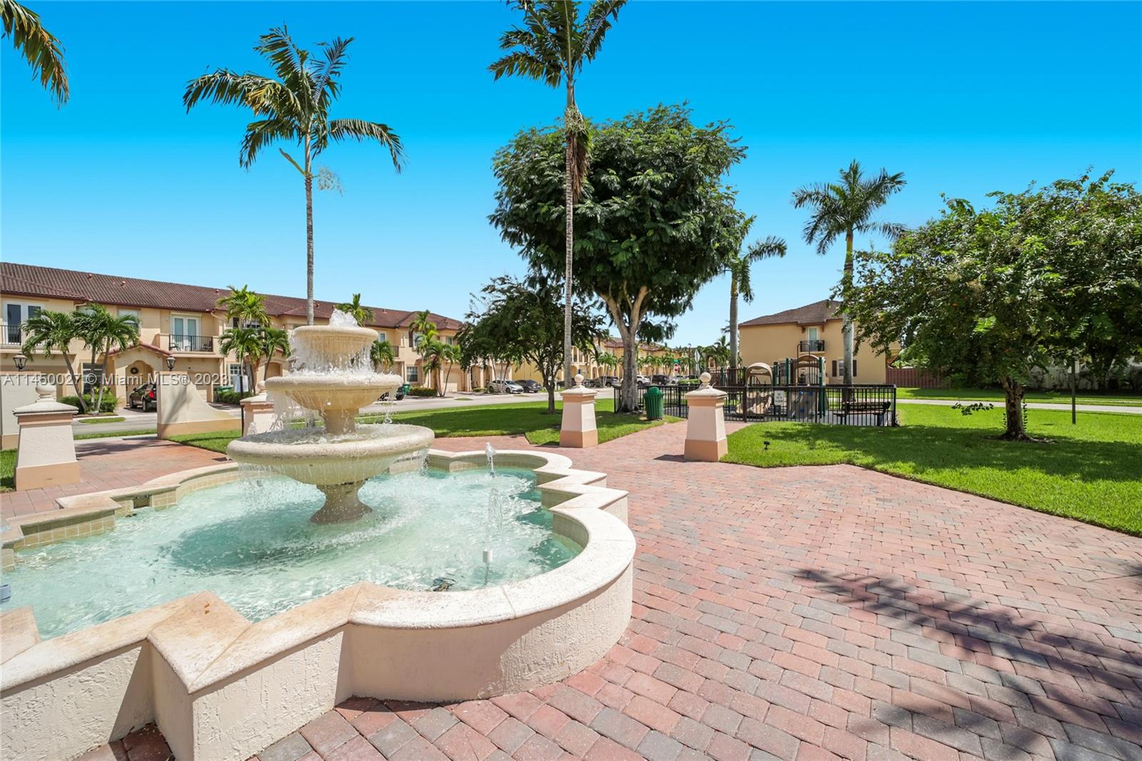 12953 Southwest 132nd Terrace Miami, FL 33186 - Photo 36 of 36 a view of a swimming pool with a yard