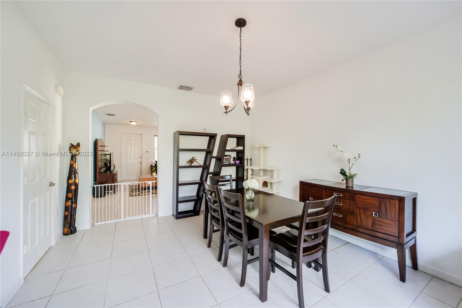 12953 Southwest 132nd Terrace Miami, FL 33186 - Photo 8 of 36 a dining room with furniture and window