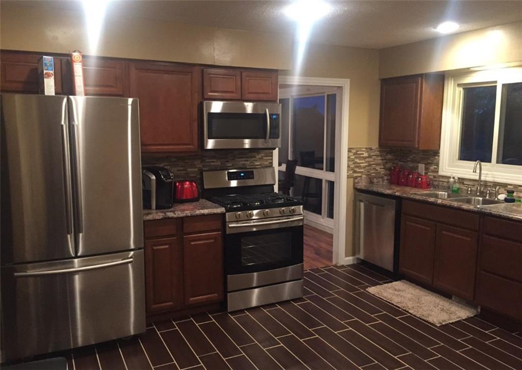 7 Herbst Road Coraopolis, PA 15108 - Photo 11 of 24 Gorgeous back splash, recessed lighting, thick grout lines.
