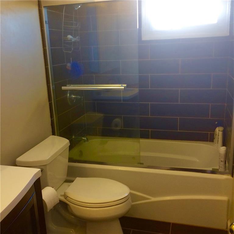 7 Herbst Road Coraopolis, PA 15108 - Photo 16 of 24 Main floor bath with glass slider doors.