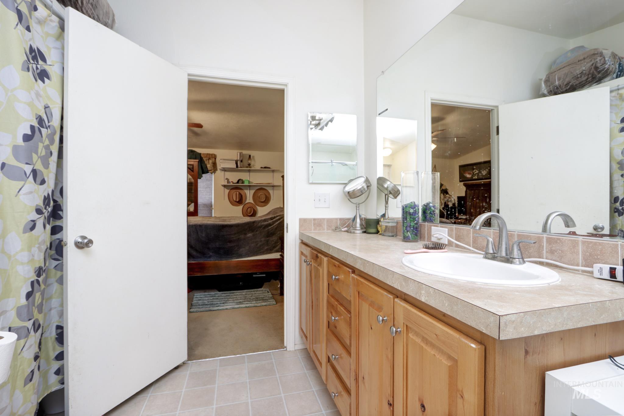 1583 Dustin Lane Vale, OR 97918 - Photo 18 of 39 Ensuite bathroom with vanity and light tile patterned floors