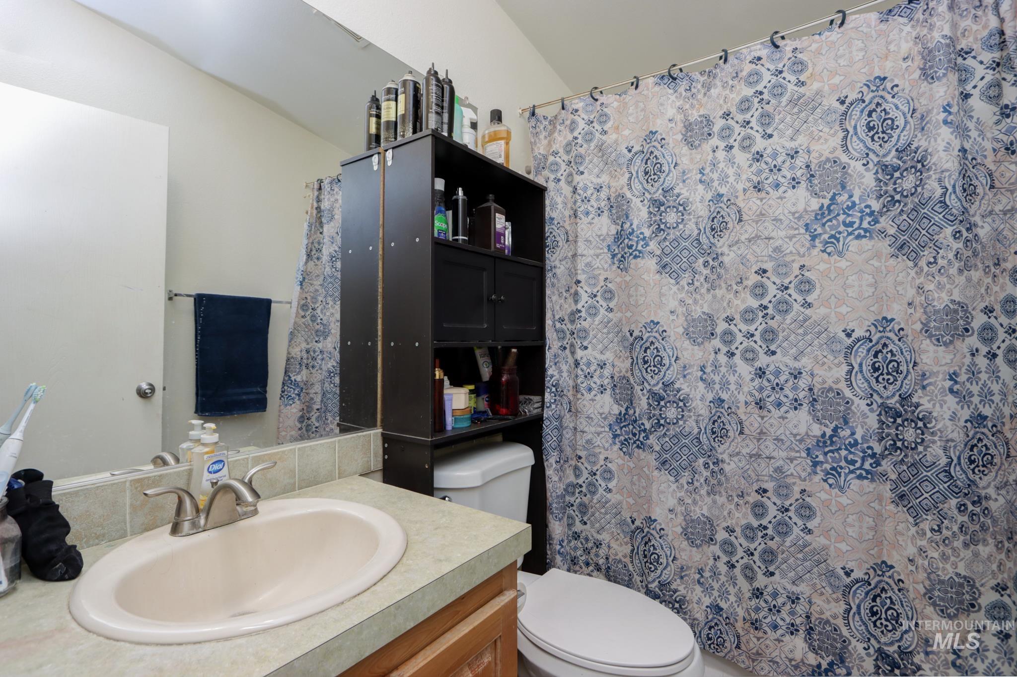 1583 Dustin Lane Vale, OR 97918 - Photo 21 of 39 Full bath with vanity and a shower with shower curtain