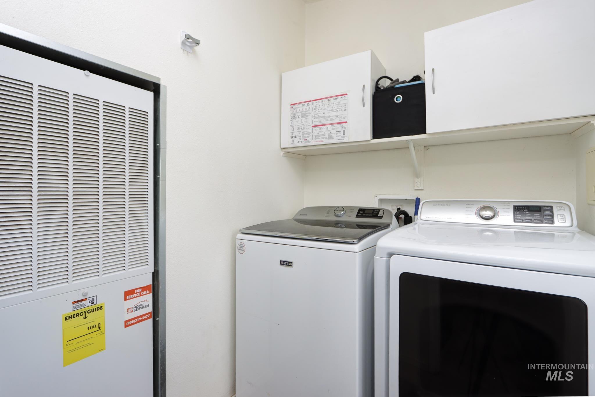 1583 Dustin Lane Vale, OR 97918 - Photo 24 of 39 Laundry room with a heating unit and separate washer and dryer