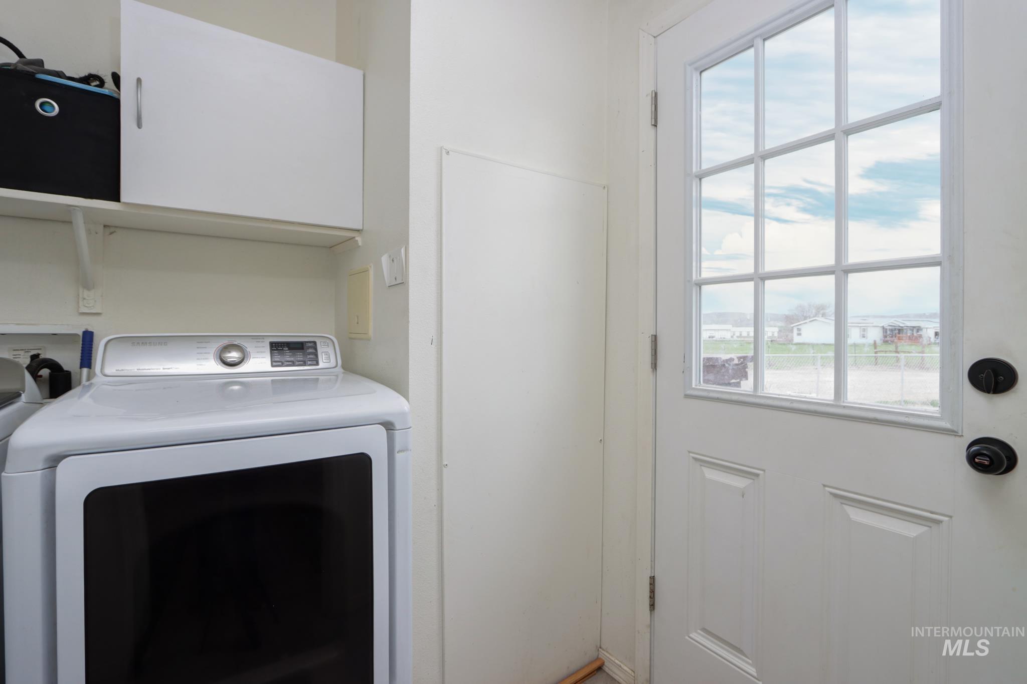 1583 Dustin Lane Vale, OR 97918 - Photo 25 of 39 Laundry area featuring cabinet space and washing machine and clothes dryer