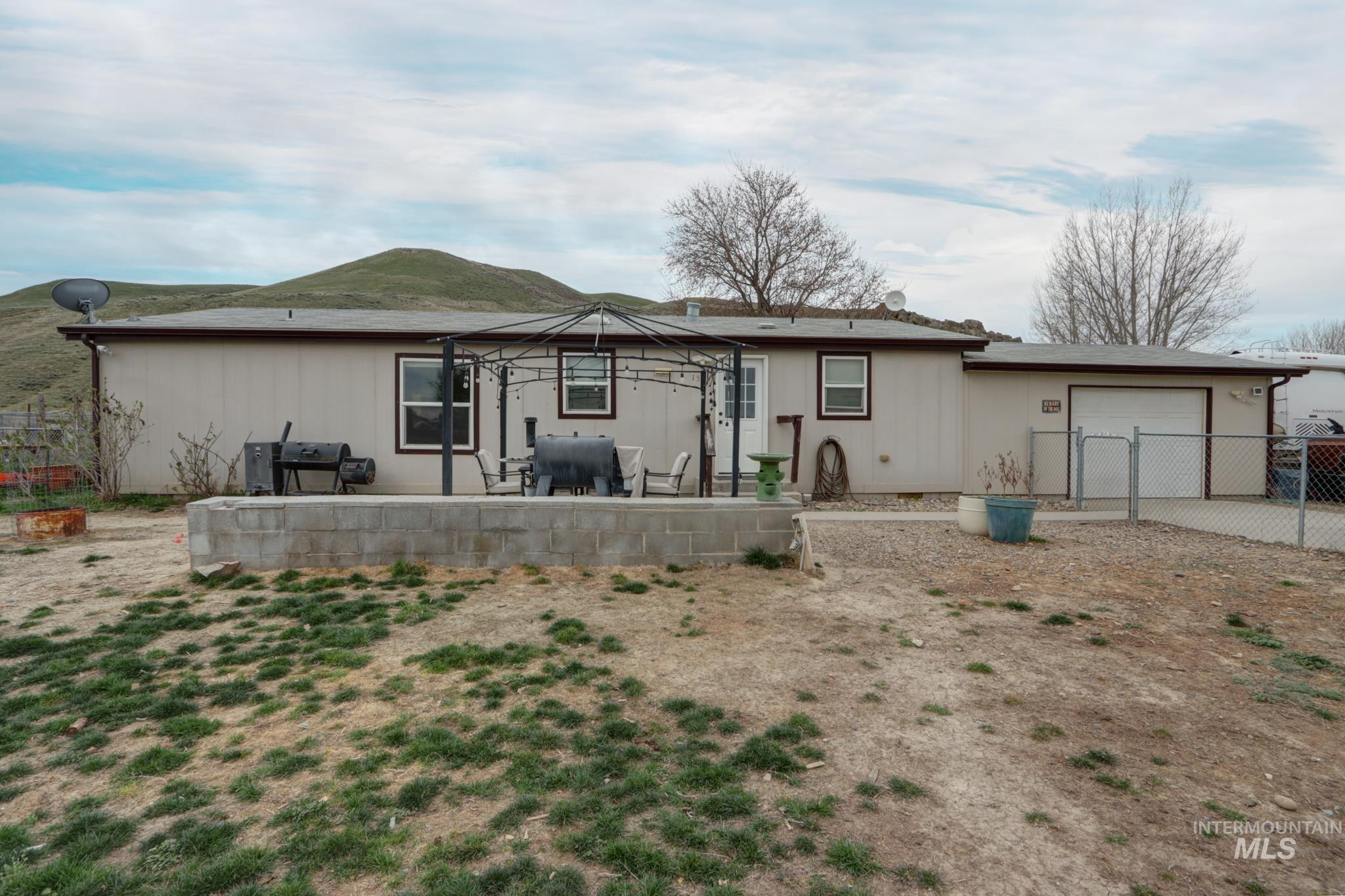 1583 Dustin Lane Vale, OR 97918 - Photo 26 of 39 Back of property featuring a patio and an attached garage