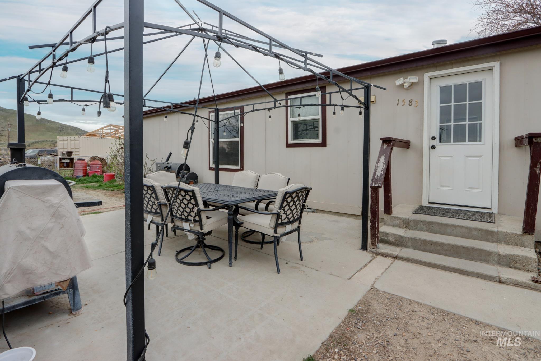 1583 Dustin Lane Vale, OR 97918 - Photo 30 of 39 View of patio with outdoor dining area and a grill
