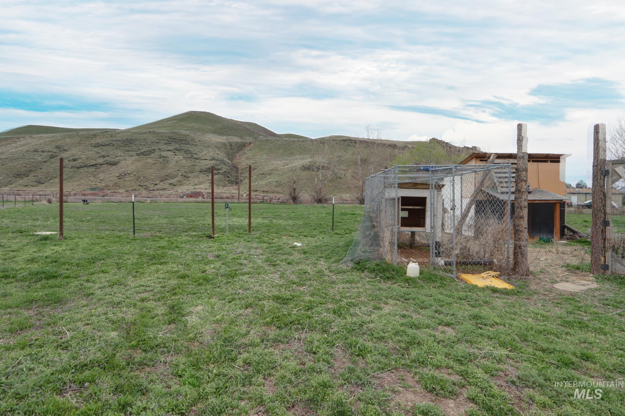 1583 Dustin Lane Vale, OR 97918 - Photo 39 of 39 View of yard with an outdoor structure, exterior structure, a view of rural / pastoral area, and a mountain view