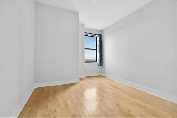 a view of an empty room and window
