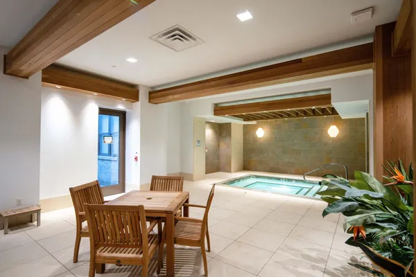 a dining room with a table and chairs