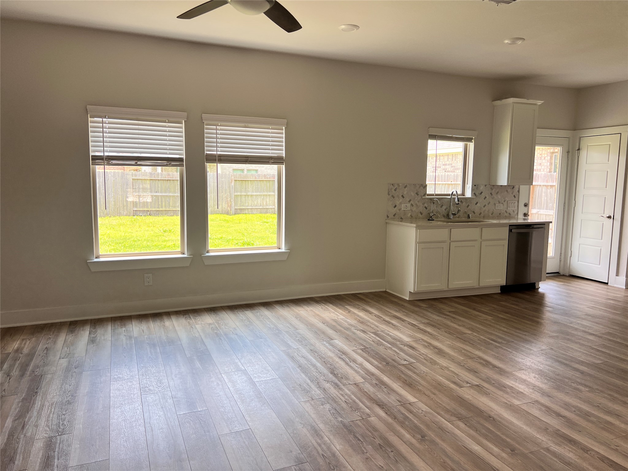 10638 Whitejacket Conroe, TX 77385 - Photo 21 of 25 a view of an empty room with a window and wooden floor