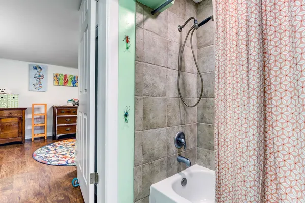 a bathroom with a sink a toilet and mirror