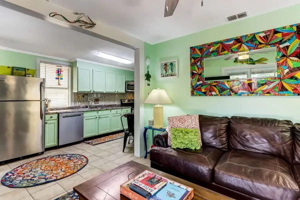 a kitchen with stainless steel appliances granite countertop a refrigerator sink and cabinets