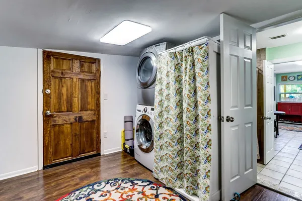 a view of walk in closet with wooden floor