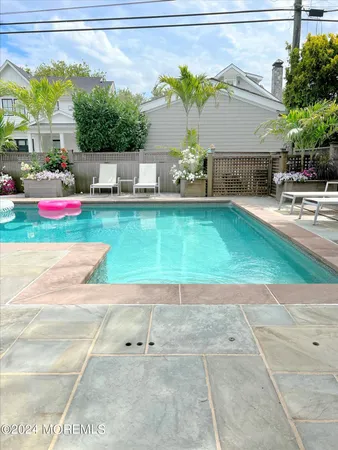 a view of outdoor space with wooden floor and city view