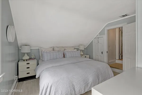 a bedroom with a bed and a closet