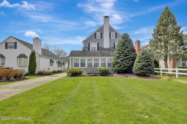 a view of a livingroom with furniture and a flat screen tv