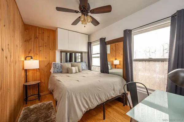 a bedroom with a bed and a window