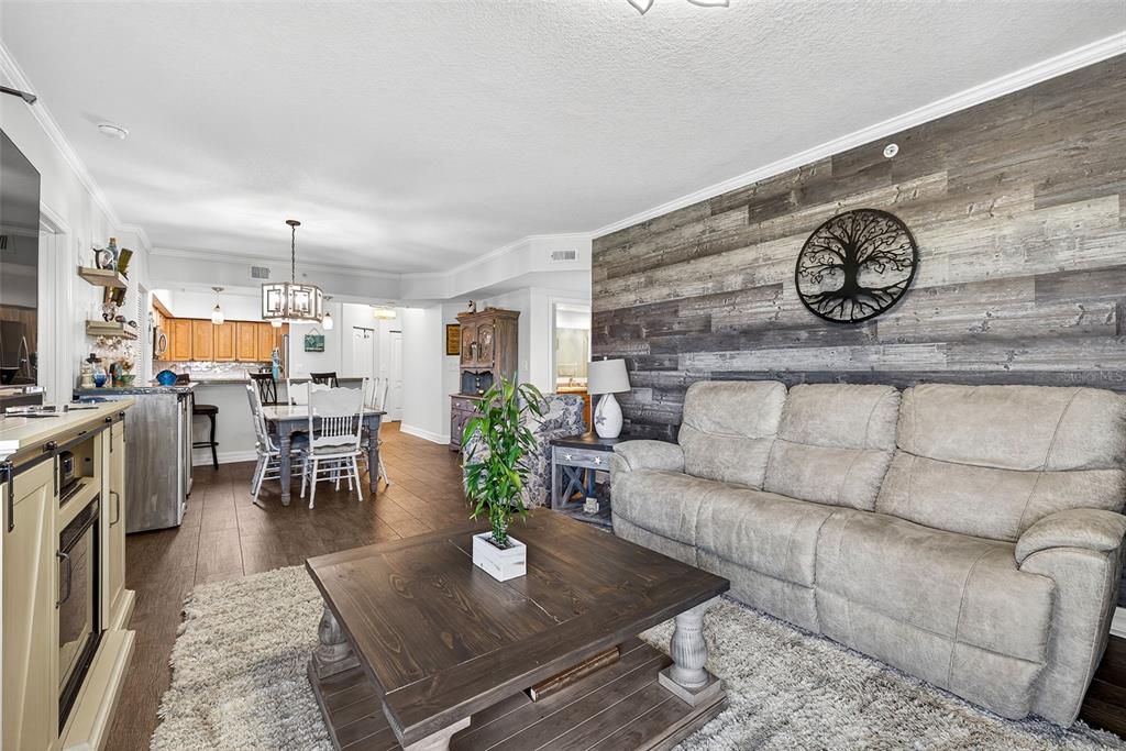 4516 Seagull Drive, Unit 519 New Port Richey, FL 34652 - Photo 17 of 54 a living room with furniture and a table