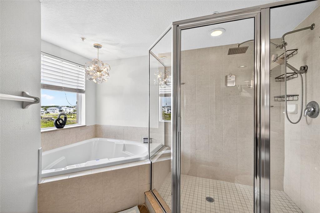 4516 Seagull Drive, Unit 519 New Port Richey, FL 34652 - Photo 26 of 54 a bathroom with a bathtub and a shower