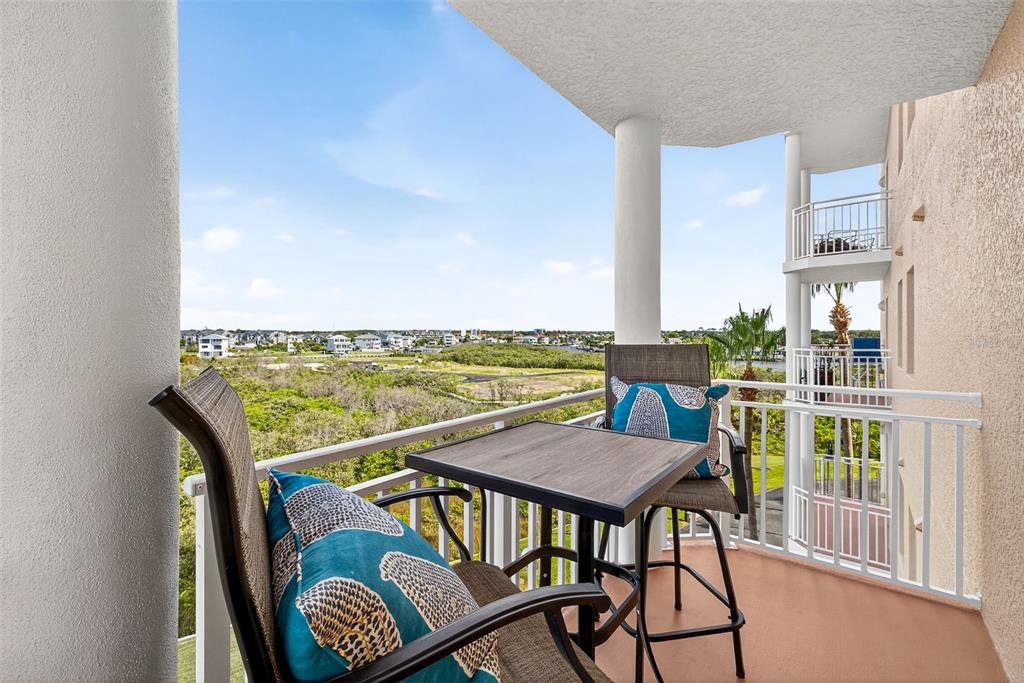 4516 Seagull Drive, Unit 519 New Port Richey, FL 34652 - Photo 28 of 54 a view of a balcony with chair and city view