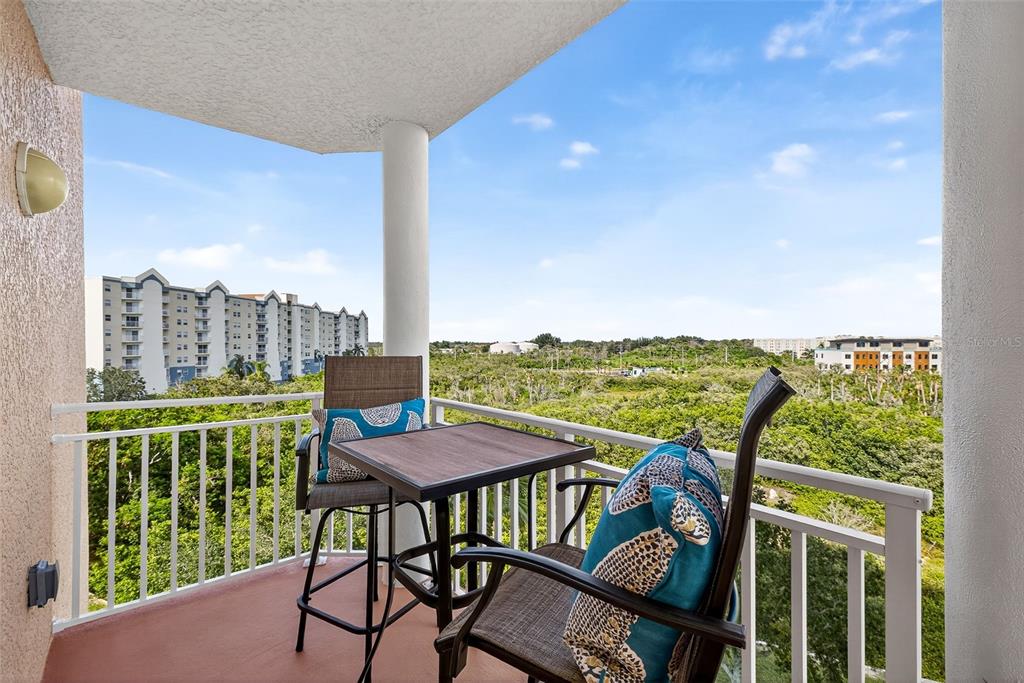 4516 Seagull Drive, Unit 519 New Port Richey, FL 34652 - Photo 29 of 54 a view of a city from a balcony with furniture