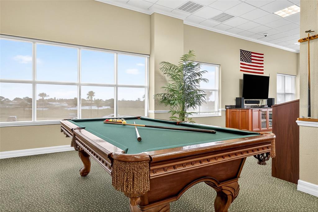 4516 Seagull Drive, Unit 519 New Port Richey, FL 34652 - Photo 39 of 54 a room with pool table and windows