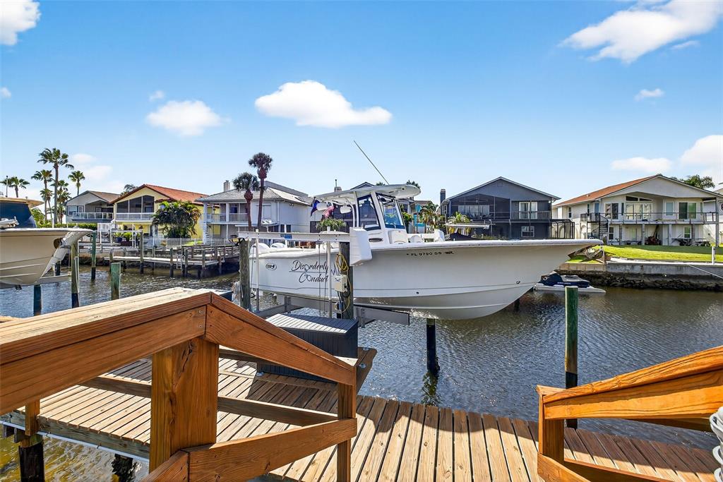 4516 Seagull Drive, Unit 519 New Port Richey, FL 34652 - Photo 44 of 54 a view of a kitchen with furniture and stove