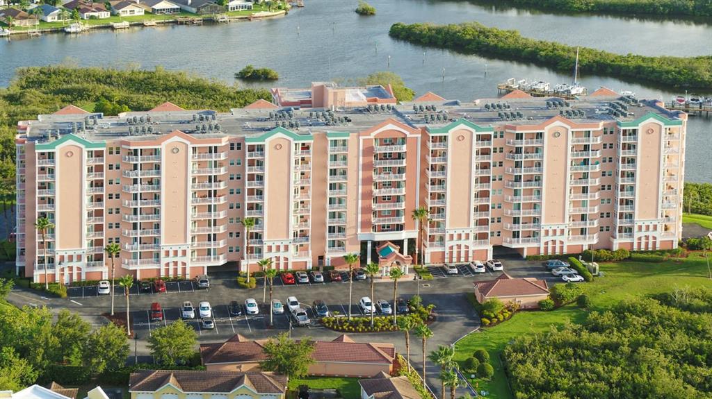 4516 Seagull Drive, Unit 519 New Port Richey, FL 34652 - Photo 45 of 54 a front view of building with outdoor space and lake view