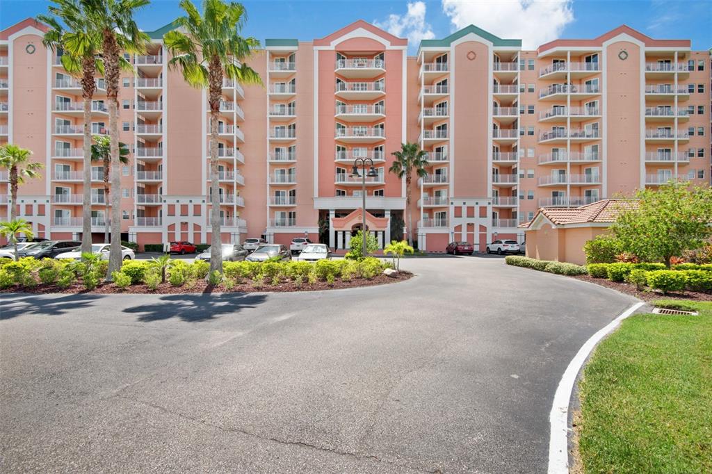 4516 Seagull Drive, Unit 519 New Port Richey, FL 34652 - Photo 47 of 54 a front view of a building with outdoor space and parking