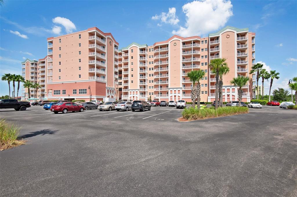 4516 Seagull Drive, Unit 519 New Port Richey, FL 34652 - Photo 48 of 54 a building with car parked in front of it