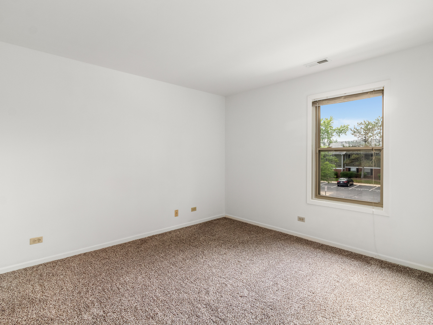 1340 McDowell Road, Unit 202 Naperville, IL 60563 - Photo 14 of 24 an empty room with windows