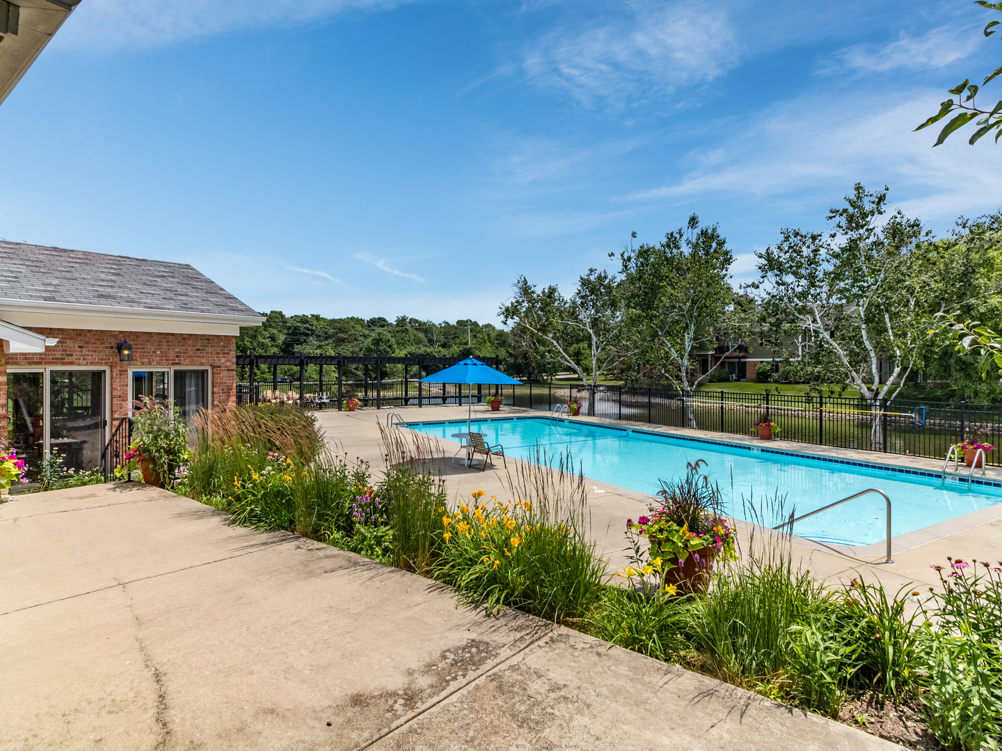 1340 McDowell Road, Unit 202 Naperville, IL 60563 - Photo 22 of 24 a view of a swimming pool with a patio