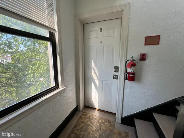 a view of a room that has a window in it