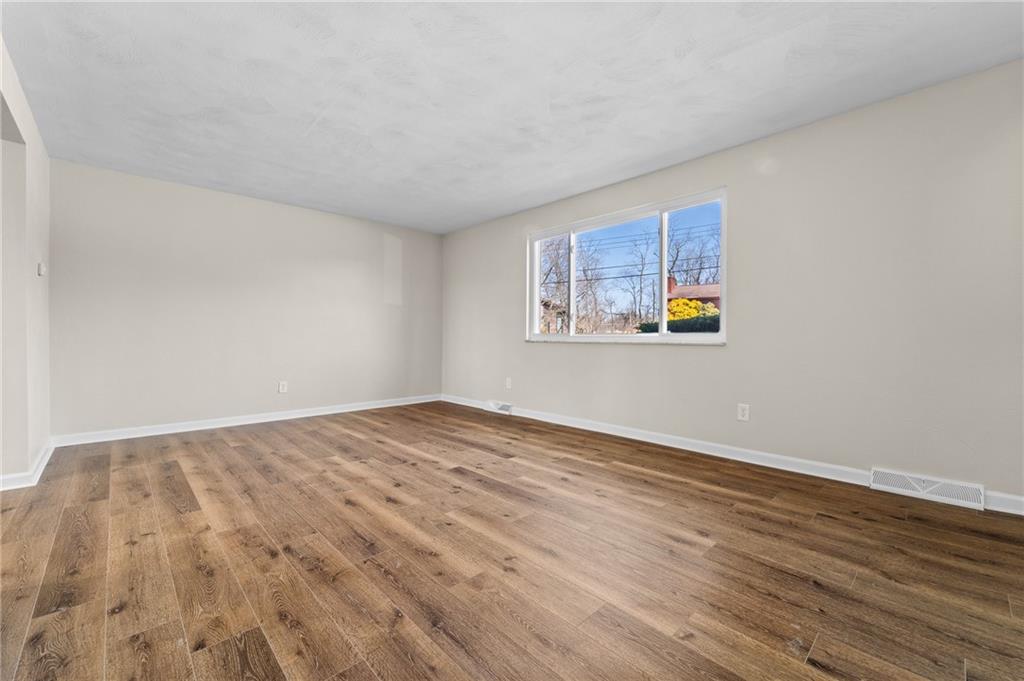10 Rushmore Drive Pittsburgh, PA 15235 - Photo 14 of 37 a view of empty room with wooden floor and fan