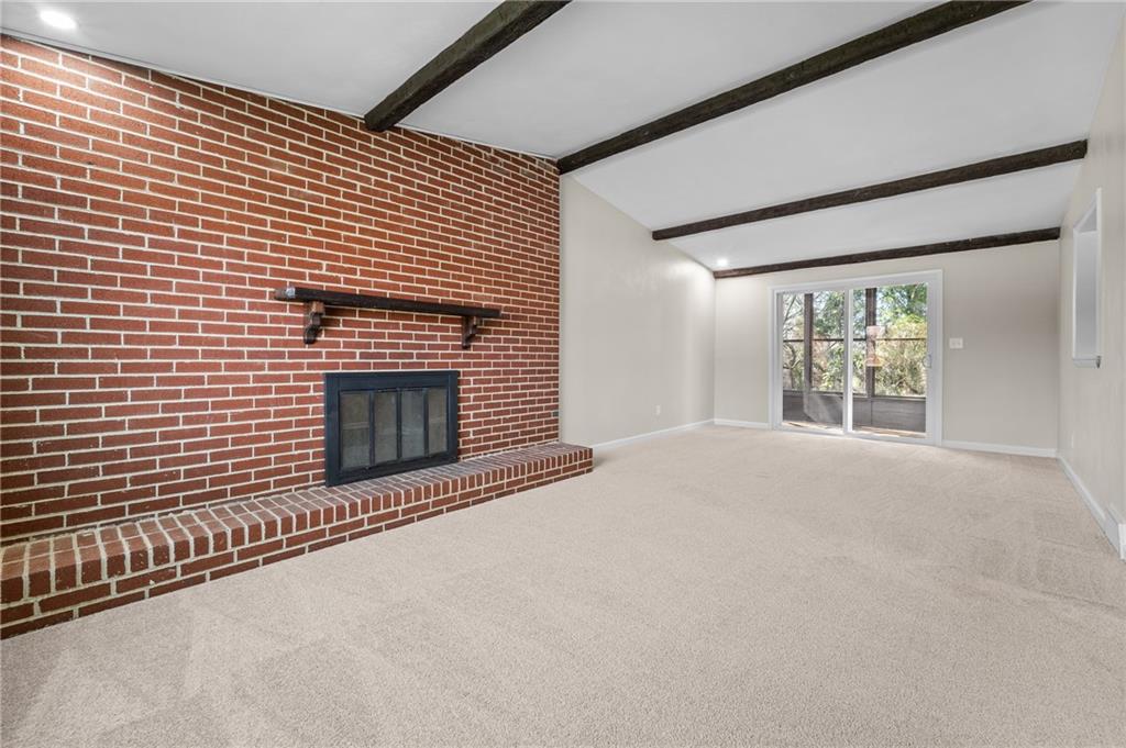 10 Rushmore Drive Pittsburgh, PA 15235 - Photo 8 of 37 a view of an empty room with a fireplace