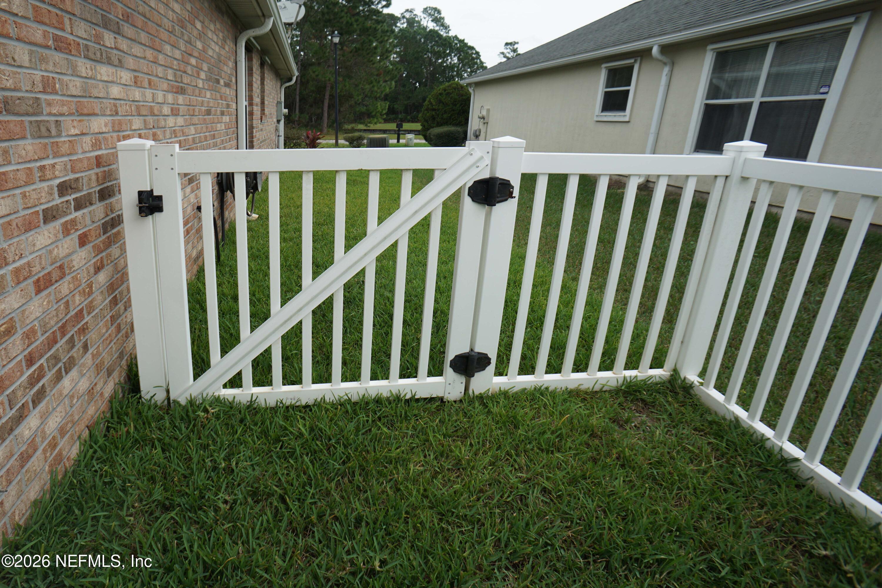 1721 Keswick Road St. Augustine, FL 32084 - Photo 16 of 17 a view of a house with backyard and porch
