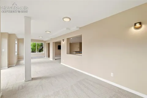 a view of hallway with wooden floor