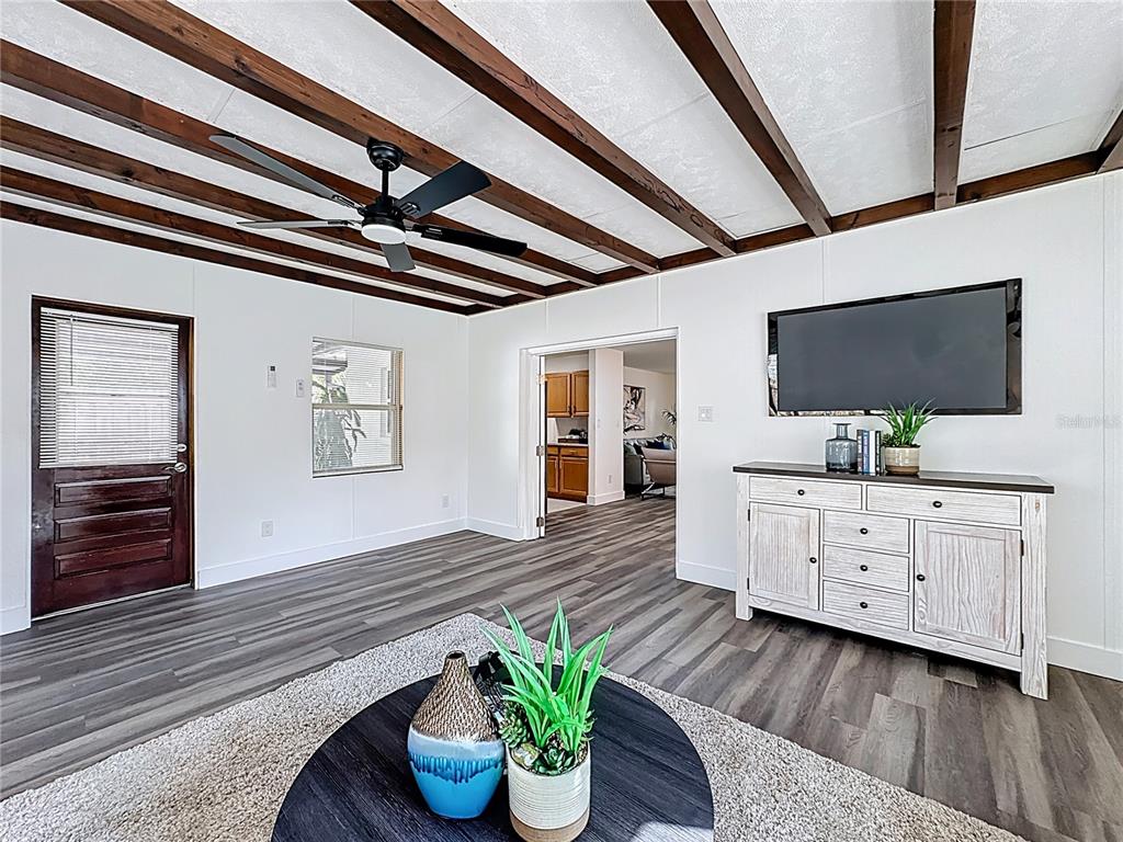 116 Exeter Avenue Longwood, FL 32750 - Photo 11 of 21 a living room with furniture and a flat screen tv