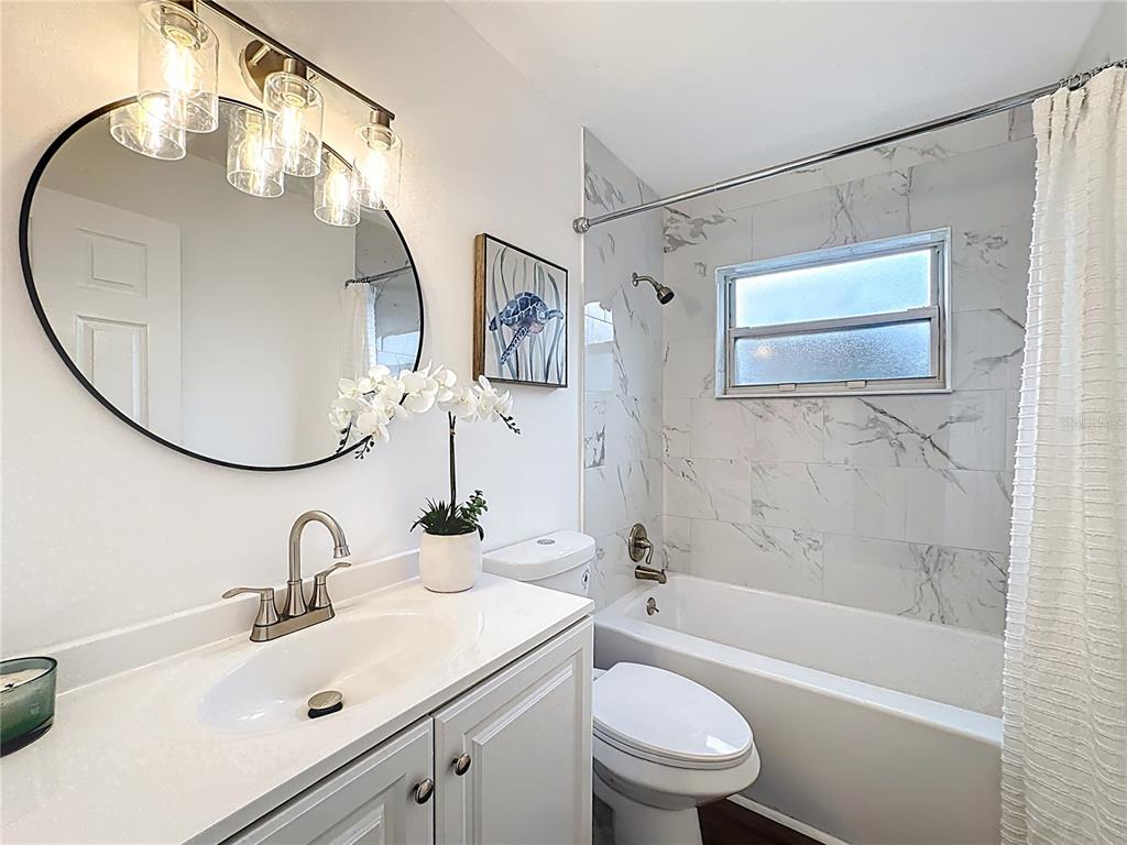 116 Exeter Avenue Longwood, FL 32750 - Photo 12 of 21 a bathroom with a sink a toilet and a mirror