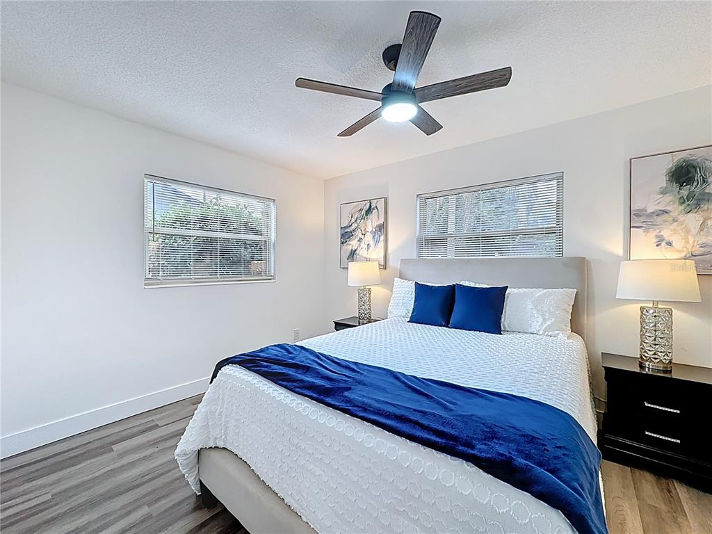 116 Exeter Avenue Longwood, FL 32750 - Photo 14 of 21 a bedroom with a bed and wooden floor