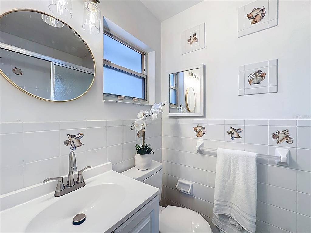 116 Exeter Avenue Longwood, FL 32750 - Photo 15 of 21 a bathroom with a sink toilet and mirror