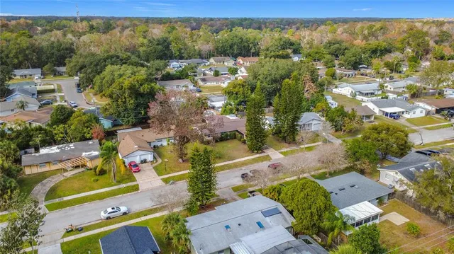 an aerial view of residential houses with outdoor space