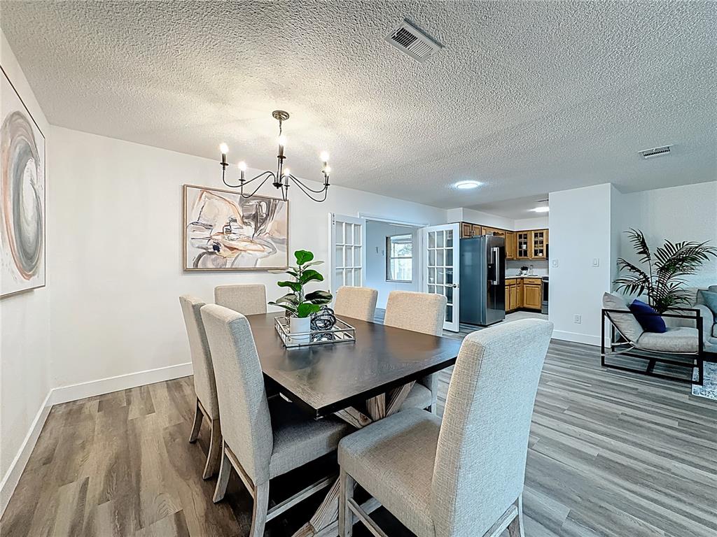 116 Exeter Avenue Longwood, FL 32750 - Photo 5 of 21 a view of a dining room with furniture and wooden floor